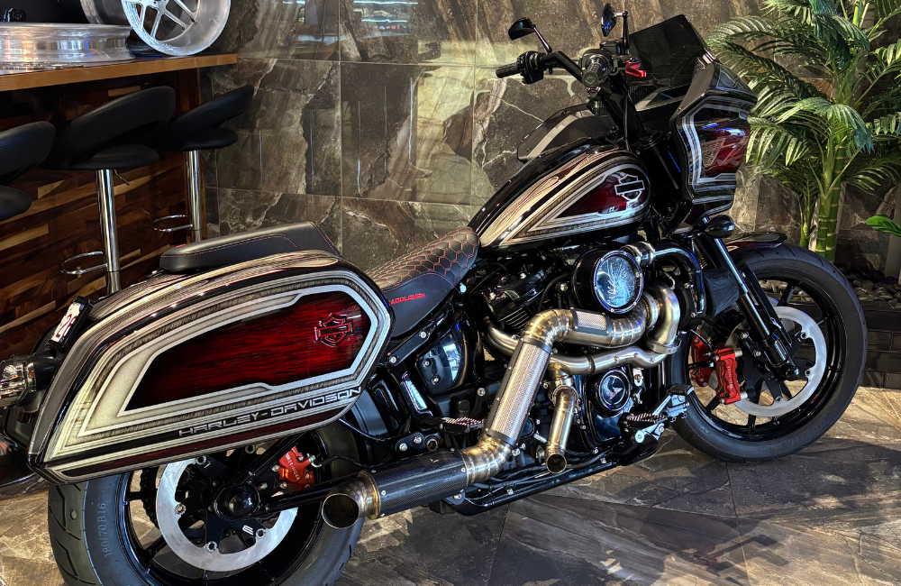 A vintage Harley Davidson motorcycle parked in the Taverner Motorsports workshop.