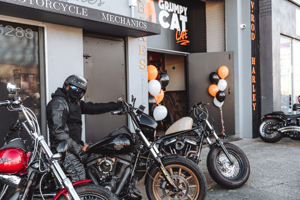A motorcycle rider outside Taverner Motorsports workshop.